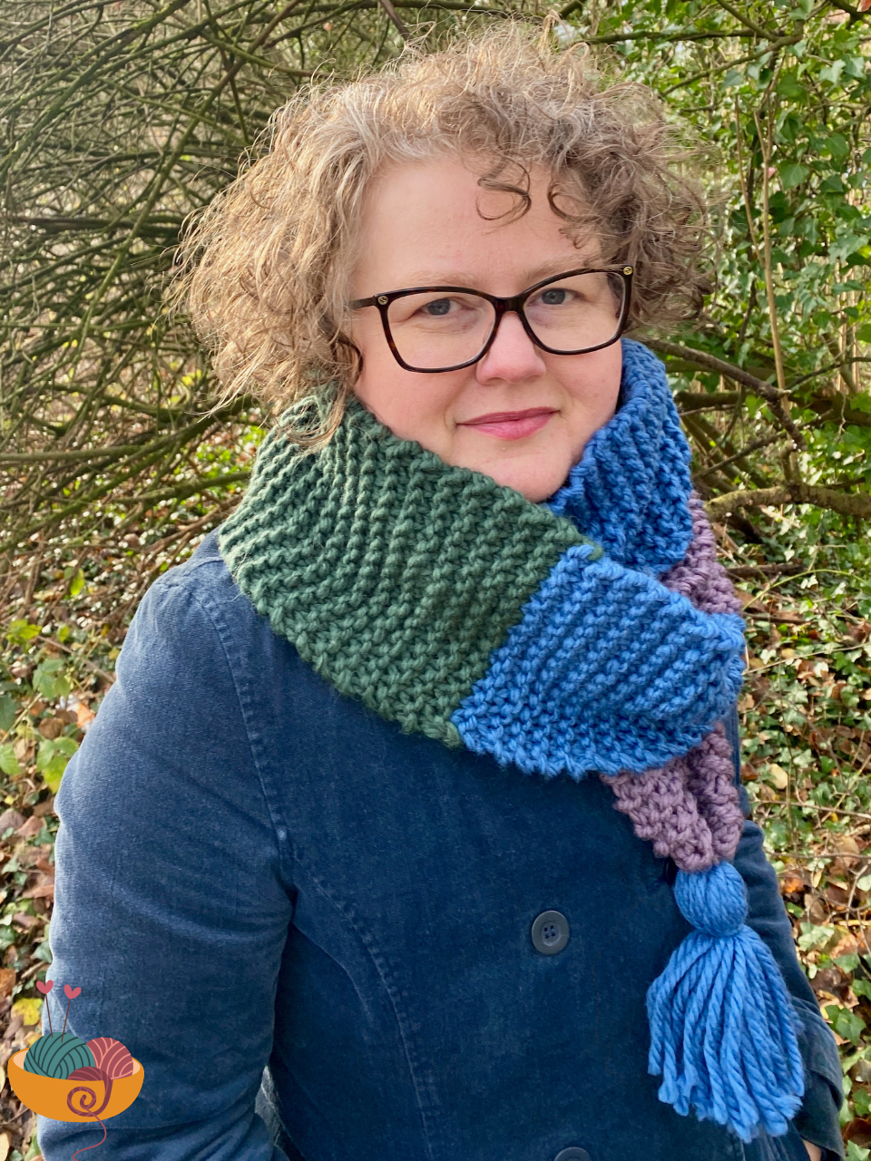 Hannah wearing scarf and dark blue velvetcoat