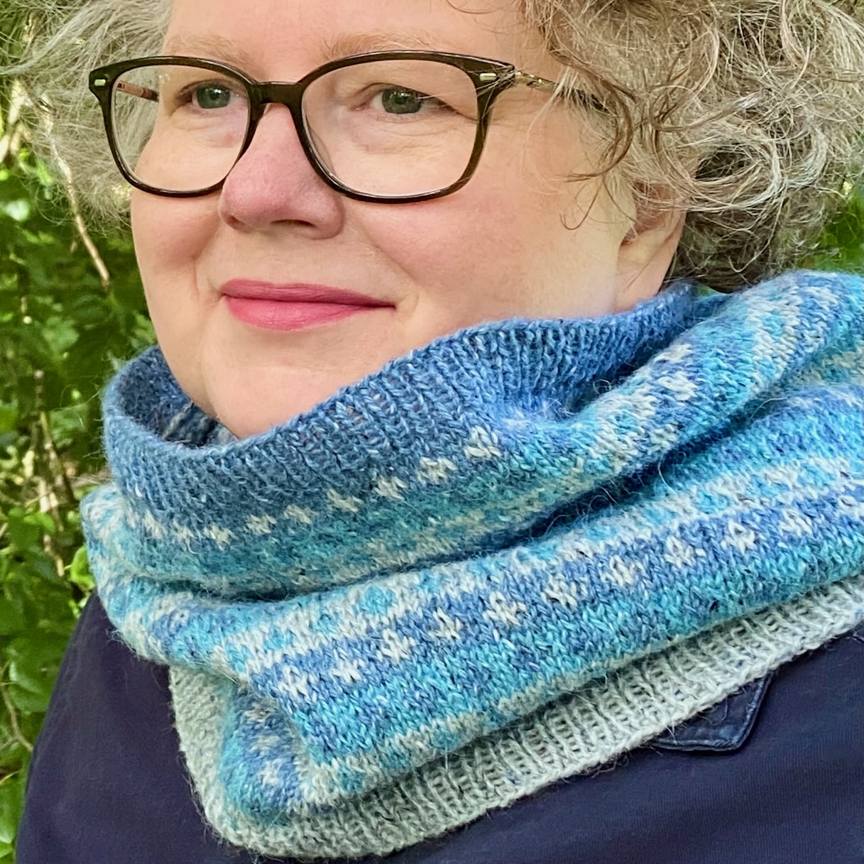 Close up of green blue and purple cowl